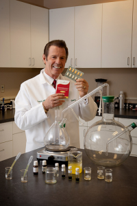 Gary Young displaying Essentialzyme product