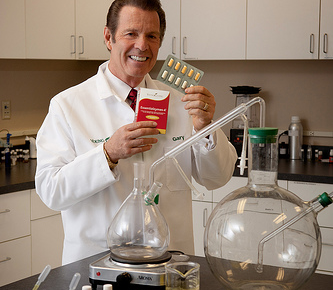 Gary Young displaying Essentialzyme product