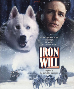 Movie poster of Iron Will with face of Will Steadman next to his racing dog and above a picture of a dogsled