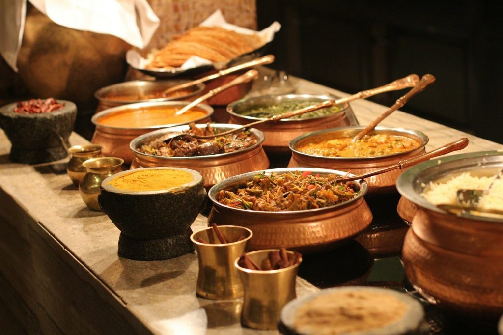 a large buffet of Indian food