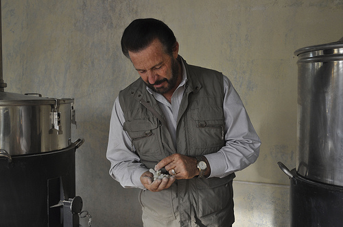 This photo shows Gary checking frankincense resin that is ready to be distilled at the YL distillery in Salalah, Oman.
