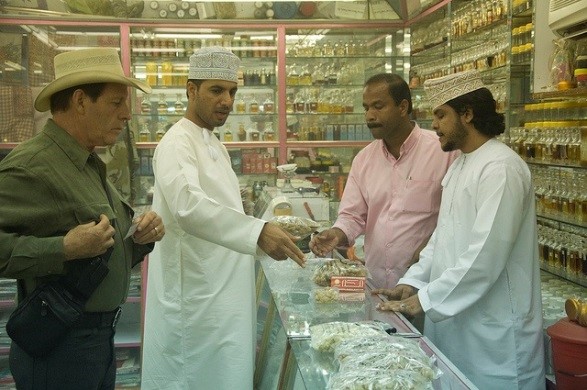 Choosing frankincense samples from a Salalah, Oman, shop to take back to the laboratory for testing.