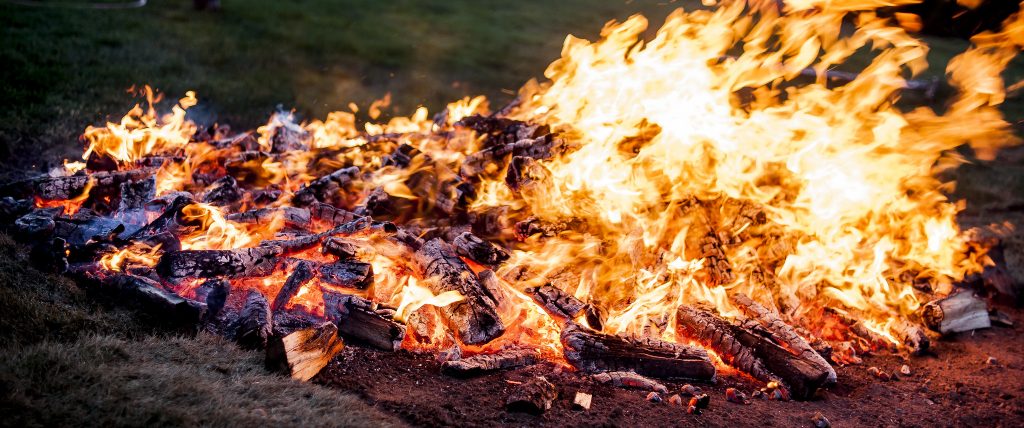 A hot fire being prepared for a fire walk.